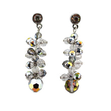 Pair of crystal bead earrings on a light gray background
