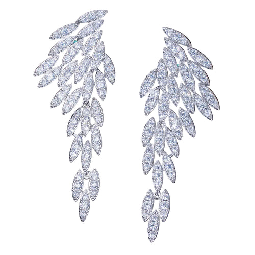 Silver wing shaped earrings on a white background