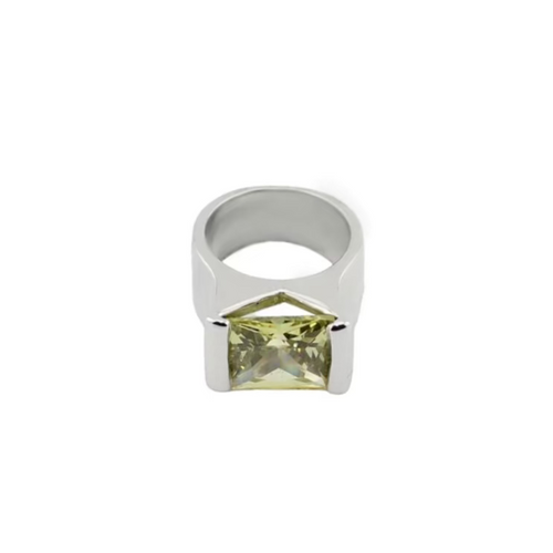 Silver ring with a green gemstone on a white background