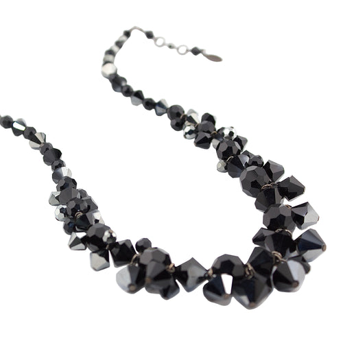 Black beaded necklace on a white background