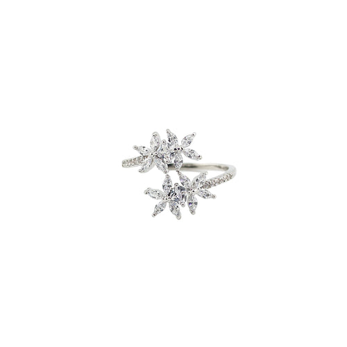 Silver ring with gemstones on a light gray background