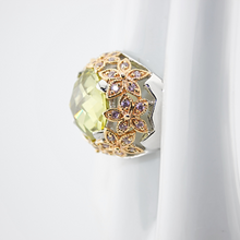 Decorative gemstone with floral design on a white background