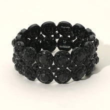 Black beaded bracelet on a white background