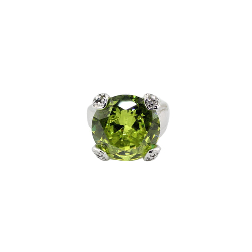 Green gemstone in a silver setting on a white background