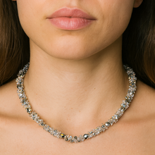 Close-up of a person wearing a sparkling necklace