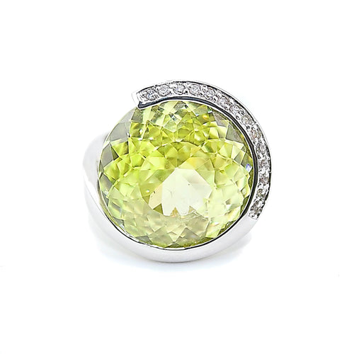 Green gemstone pendant with silver setting on a white background