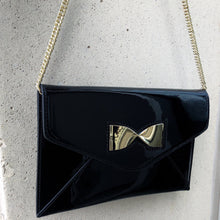 BLACK KNIGHT Faux Patent Leather Clutch with Gold Metal Bow Detail